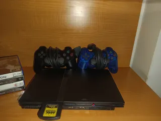 PlayStation 2 con 4 juegos y mando