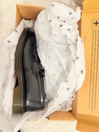 Mocassini Dr. Martens neri con frange