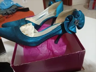 Bolso de mano azul verdoso con lazo