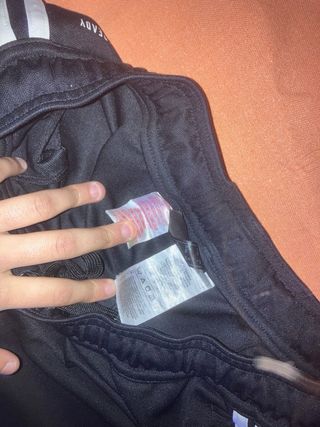 Pantaloni Adidas neri con strisce blu