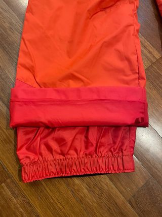 Mono de nieve naranja talla 10 años