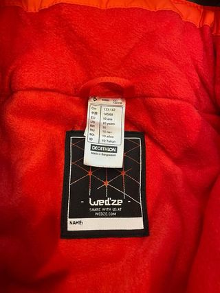 Mono de nieve naranja talla 10 años