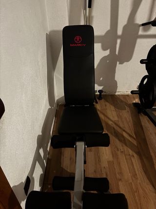 Multiestación de gimnasio + discos + accesorios