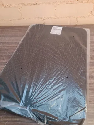 Alfombra calefactora con interruptor de pie.