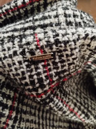 Poncho a quadri con frange