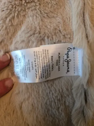 Chaqueta 3/4 de piel forrada de pelo.