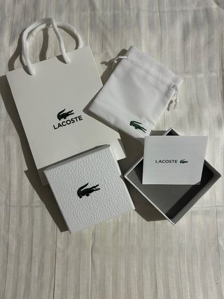 Pulsera Lacoste Plata y Negra Caja,bolsa y pulsera