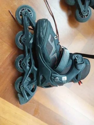 Patines (talle 35 - 38) en línea negros y naranjas