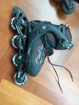 Patines (talle 35 - 38) en línea negros y naranjas