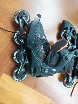 Patines (talle 35 - 38) en línea negros y naranjas