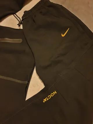 Tuta Nike x NOCTA nera e gialla