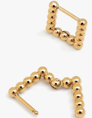 Pendientes de acero con acabado en oro 18kt.