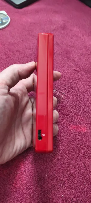 Nintendo DSi Roja + Cargador no original.