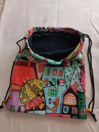 Lote: Mochila, neceser, monedero, marcapáginas ...