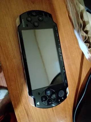 PSP Sony Negra + 2 Juegos