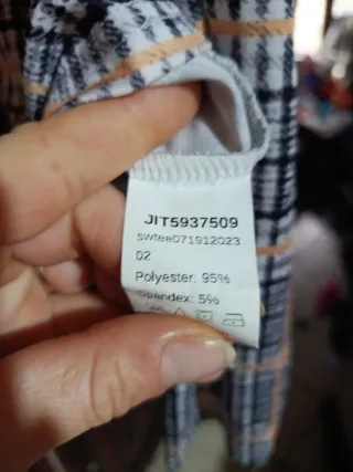 Maglia a quadri beige e nera