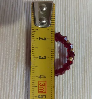 Anello spirale oro giallo 750 con cristalli rossi