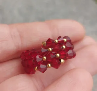 Anello spirale oro giallo 750 con cristalli rossi