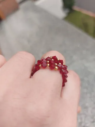 Anello spirale oro giallo 750 con cristalli rossi