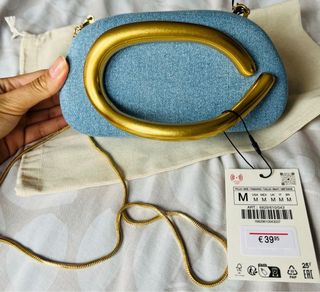 Bolso de mano denim con asa dorada