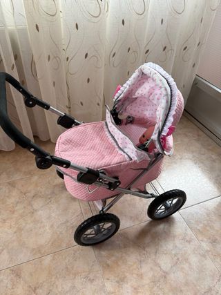 Carrito de bebé de juguete rosa