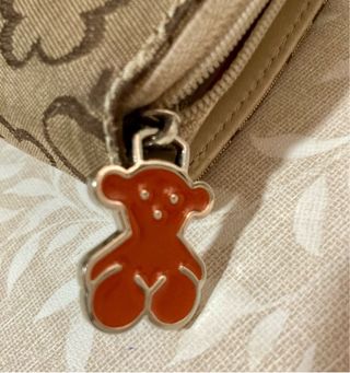 Monedero Tous color marrón y beige.