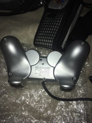 PS2 Silver Slim in condizioni perfette, mai usata, per collezionisti