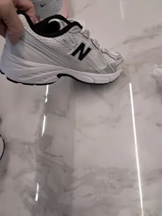 New balance 740 blancas con detalles plateados