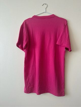 Camiseta Nike rosa con banda blanca
