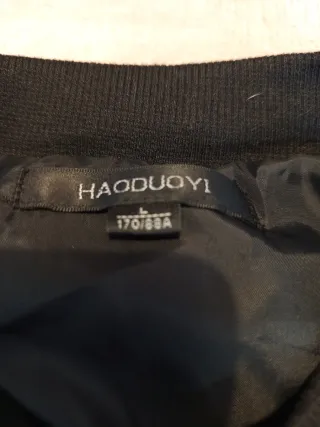 Cazadora lentejuelas moradas y plata