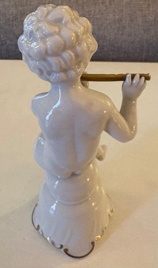 Putto con flauto porcellana Shau Bach