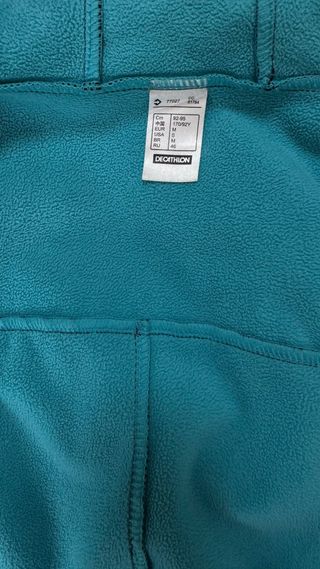 Cortavientos Quechua Negro y Turquesa