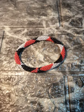 Bracciale perline nero, arancio, bianco