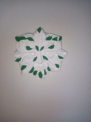 Placca decorativa da parete con viso in cemento