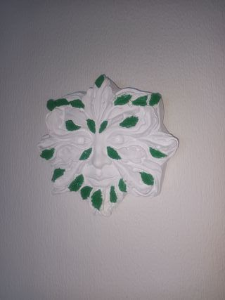 Placca decorativa da parete con viso in cemento