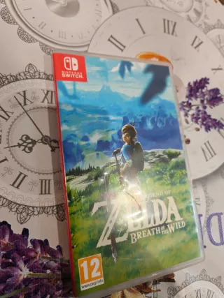 Nintendo Switch OLED Azul y Rojo + Zelda BOTW.