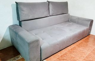 Sofá cama gris con arcón