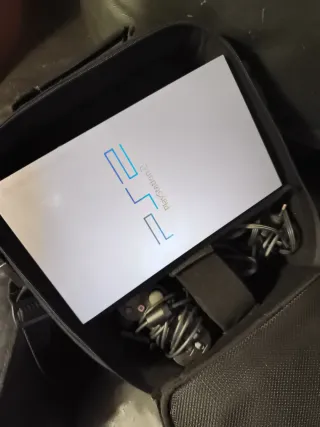 Funda Negra PlayStation 2 y PlayStation 2 completa