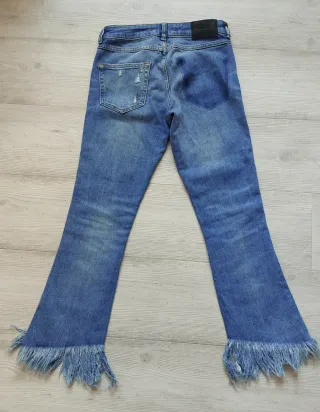 Pantalón vaquero mujer desgastado