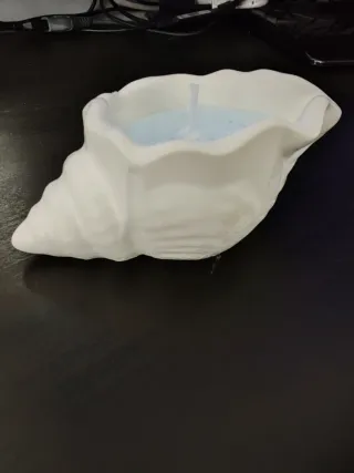 Candela a forma di conchiglia in ceramica