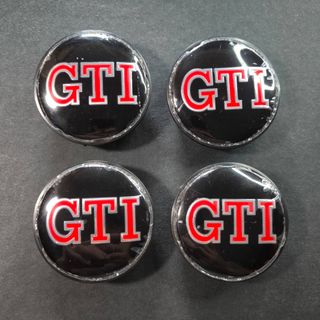 TAPABUJES VW GTI 65mm NEGROS - EMBLEMA VOLKSWAGEN