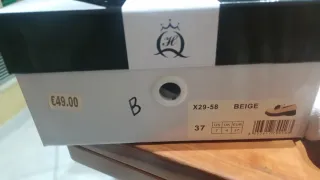 Mocassini donna beige con frange nere