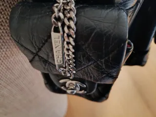 Bolso piel negra Chanel cambon reporter