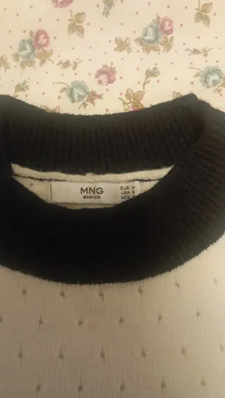 Jersey negro con vivo beige y camel.