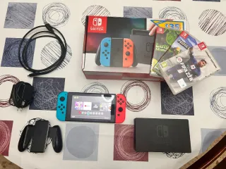 Nintendo Switch + 4 juegos y accesorios