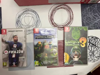 Nintendo Switch + 4 juegos y accesorios