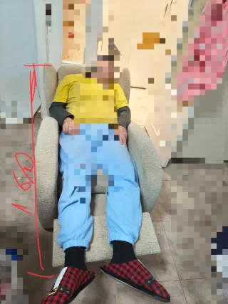 Sillón reclinable de tela beige/gris