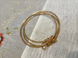 Bracciale triplo rigido dorato