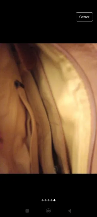 Bolso rosa con tachuelas