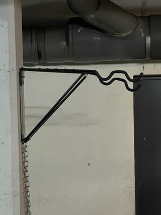 Colgador de pared para bicicletas plegable
